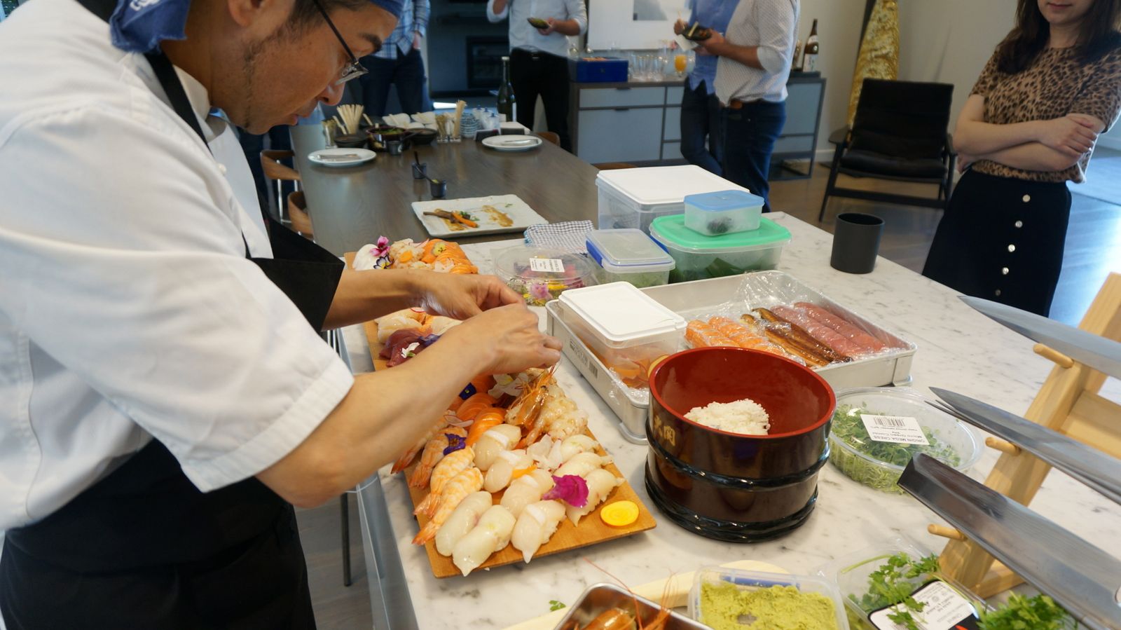 Chef preparing nigiri sushi at a private home party